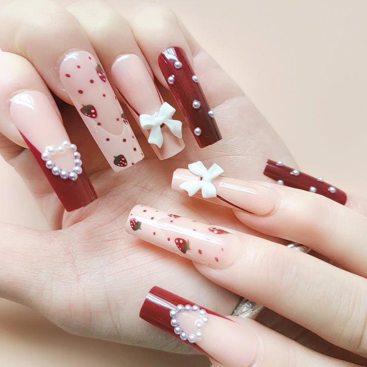 Artificial artificial nails with heart designs and holographic accents Bowlift
