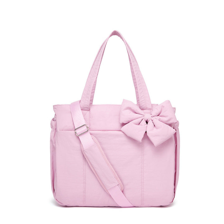 Fashionable tote bag with elegant bow appliqué Bowlift
