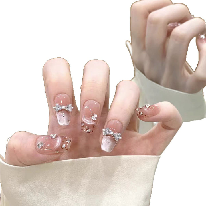 Artistic Press-On Nail Design with Floral Accents Bowlift