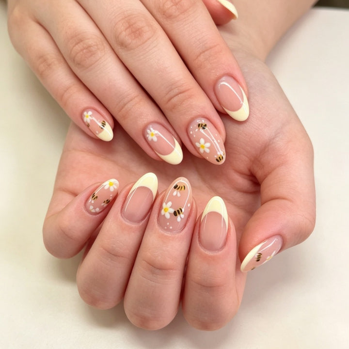 Artificial nails with elegant French tip and floral accents Bowlift