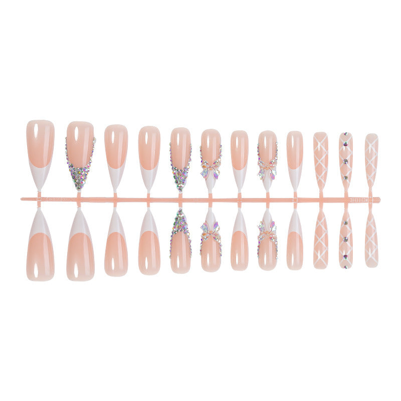 Acrylic nail set with luxurious rhinestone embellishments and bow accents Bowlift