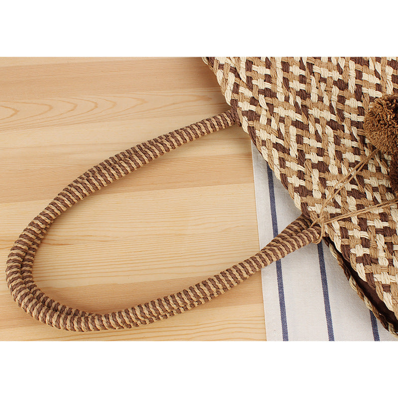 Fashionable basket bag with decorative pompons Bowlift