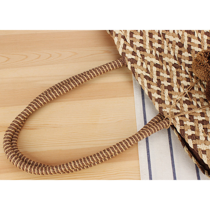 Fashionable basket bag with decorative pompons Bowlift