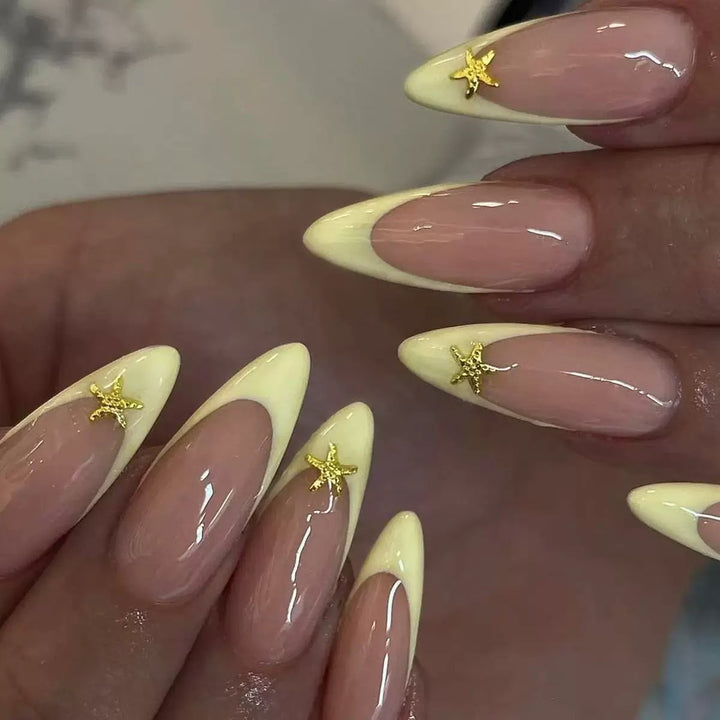 Artificial nail set with elegant tips and gold embellishments Bowlift