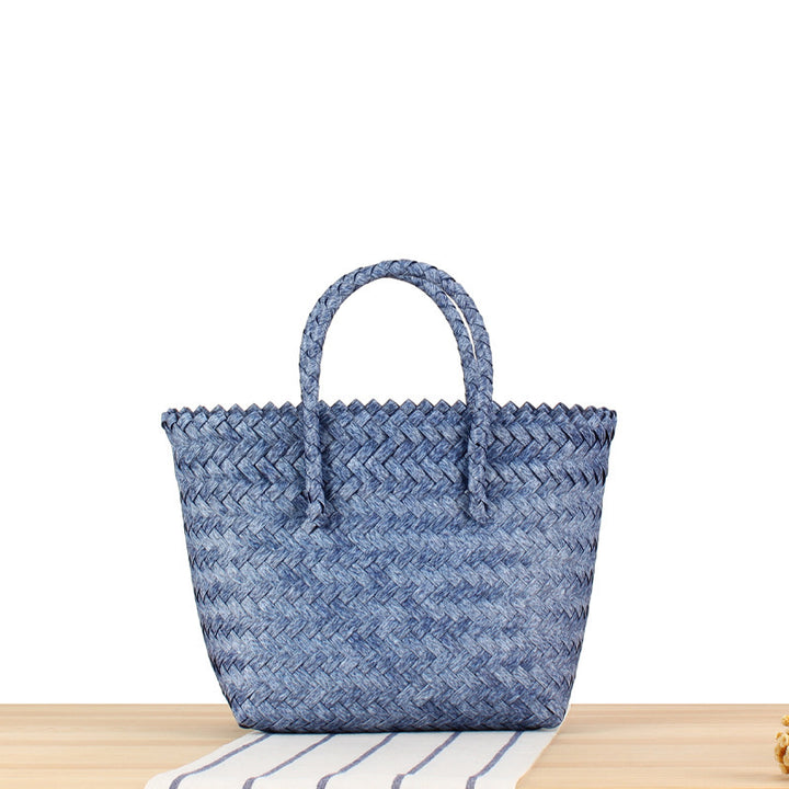 Tote bag made of handwoven natural material with braided design Bowlift
