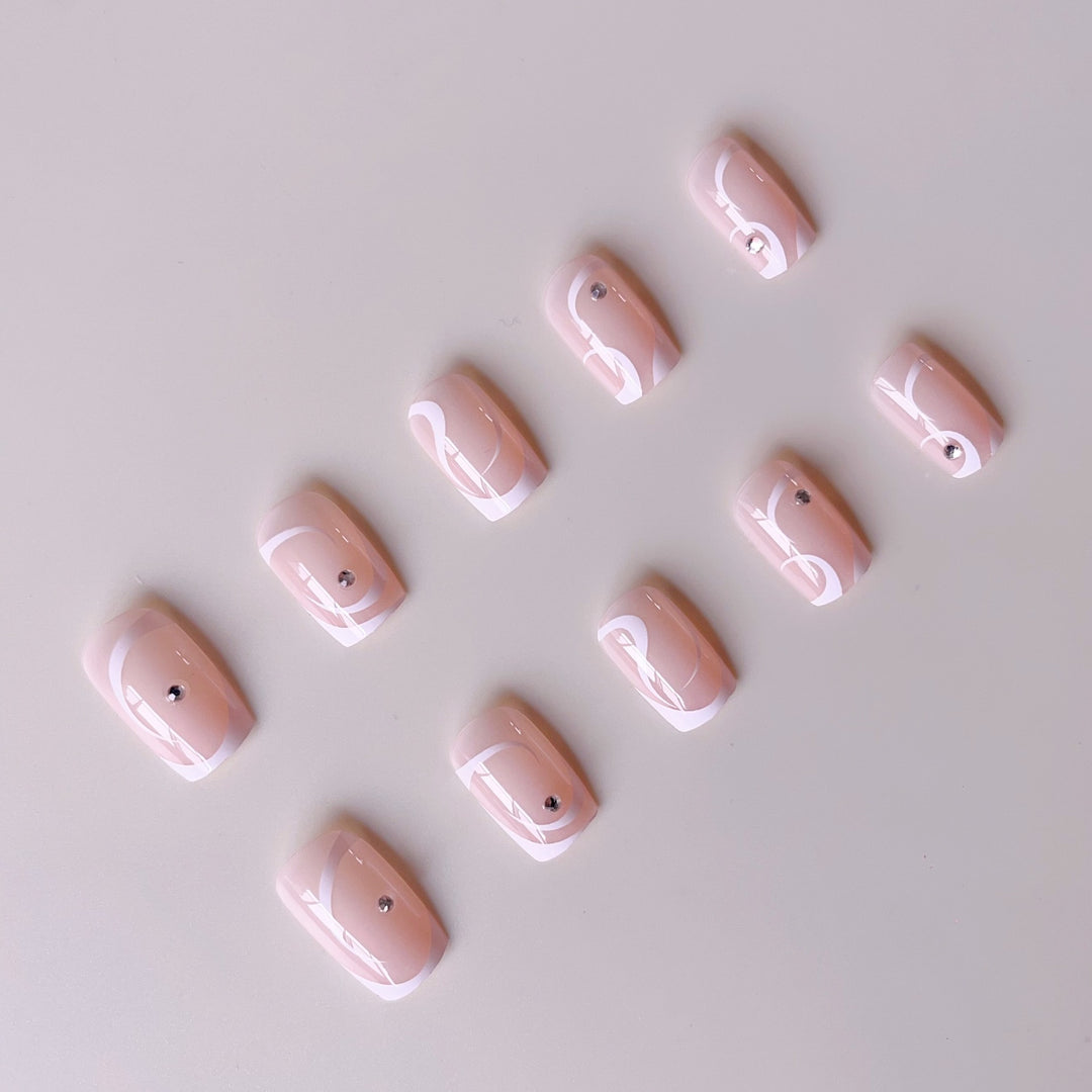 Artificial nail set with elegant French tips and glamorous rhinestone decorations Bowlift