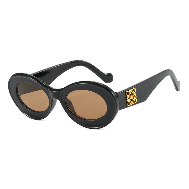 Women's fashionable sunglasses with oval frame and golden accents Bowlift