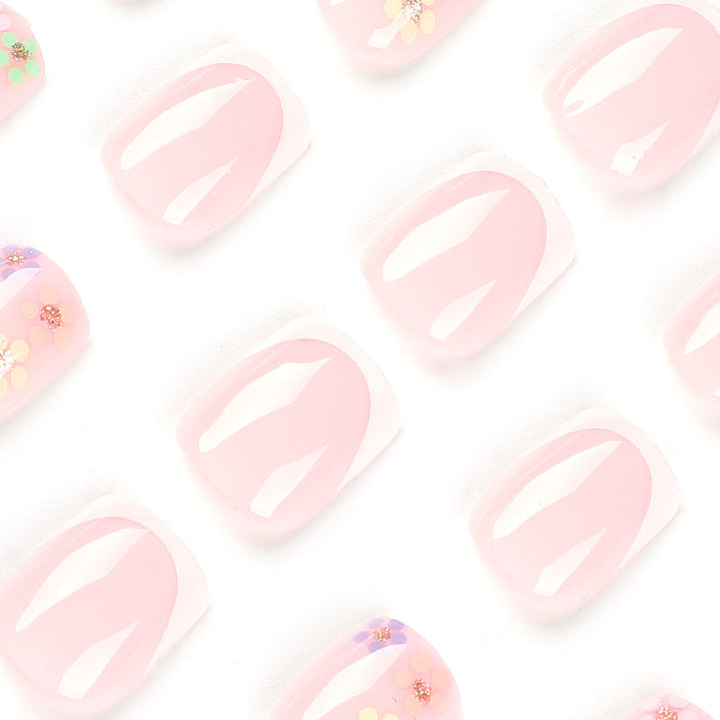 Artistic nail art with floral accent and elegant French tip Bowlift