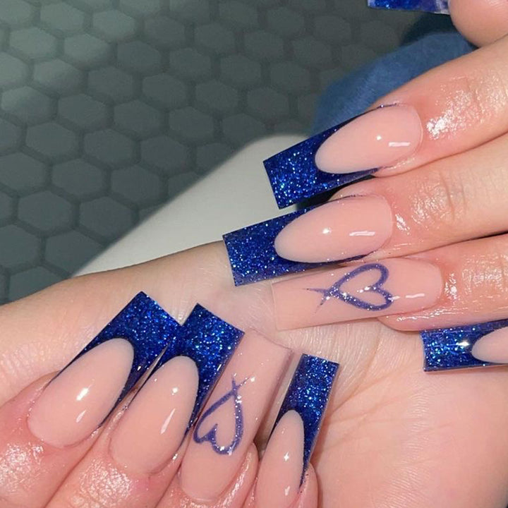 Artificial nails with glitter accents and unique heart design Bowlift