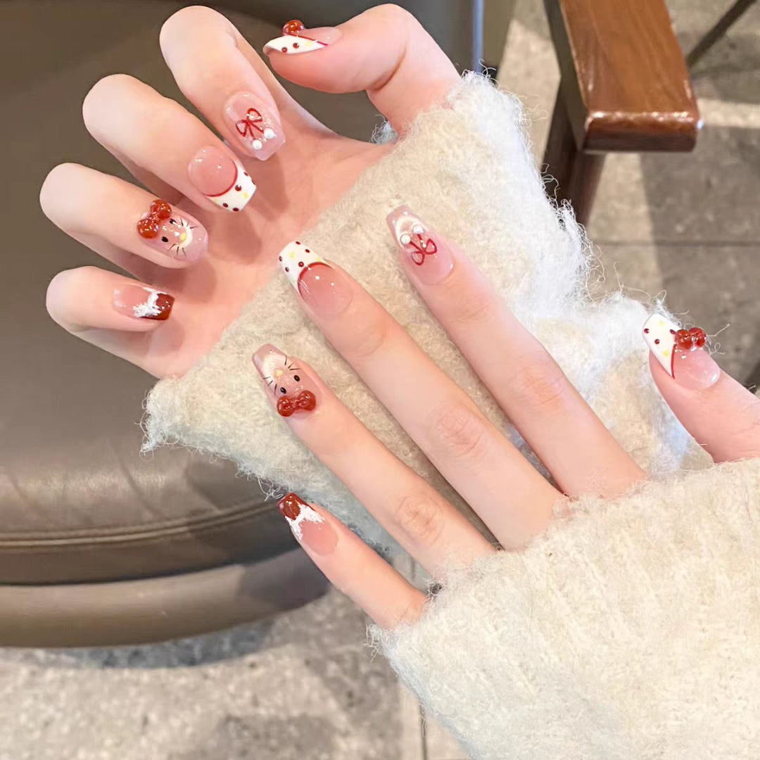 Artistic Press-On Nail Set with Whimsical Holiday Designs Bowlift