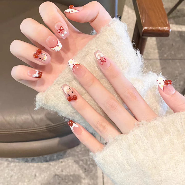 Artistic Press-On Nail Set with Whimsical Holiday Designs Bowlift