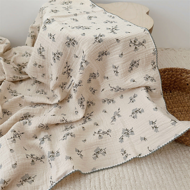 Unisex Muslin Blanket with delicate floral design and elegant ruffles Bowlift