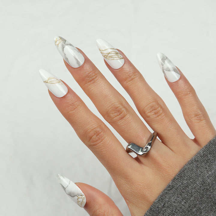 Elegant Stiletto Press-On Nails with Marble and Gold Accents Bowlift