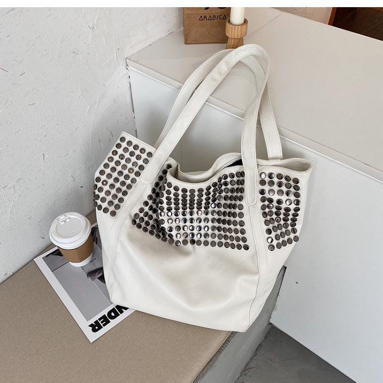 Fashionable shoulder bag with stylish rivet details Bowlift