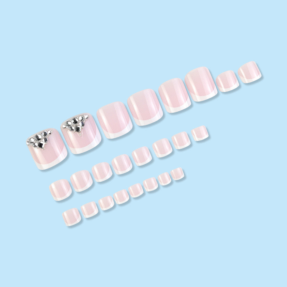 Nail art set with elegant French tips and sparkling rhinestone details Bowlift
