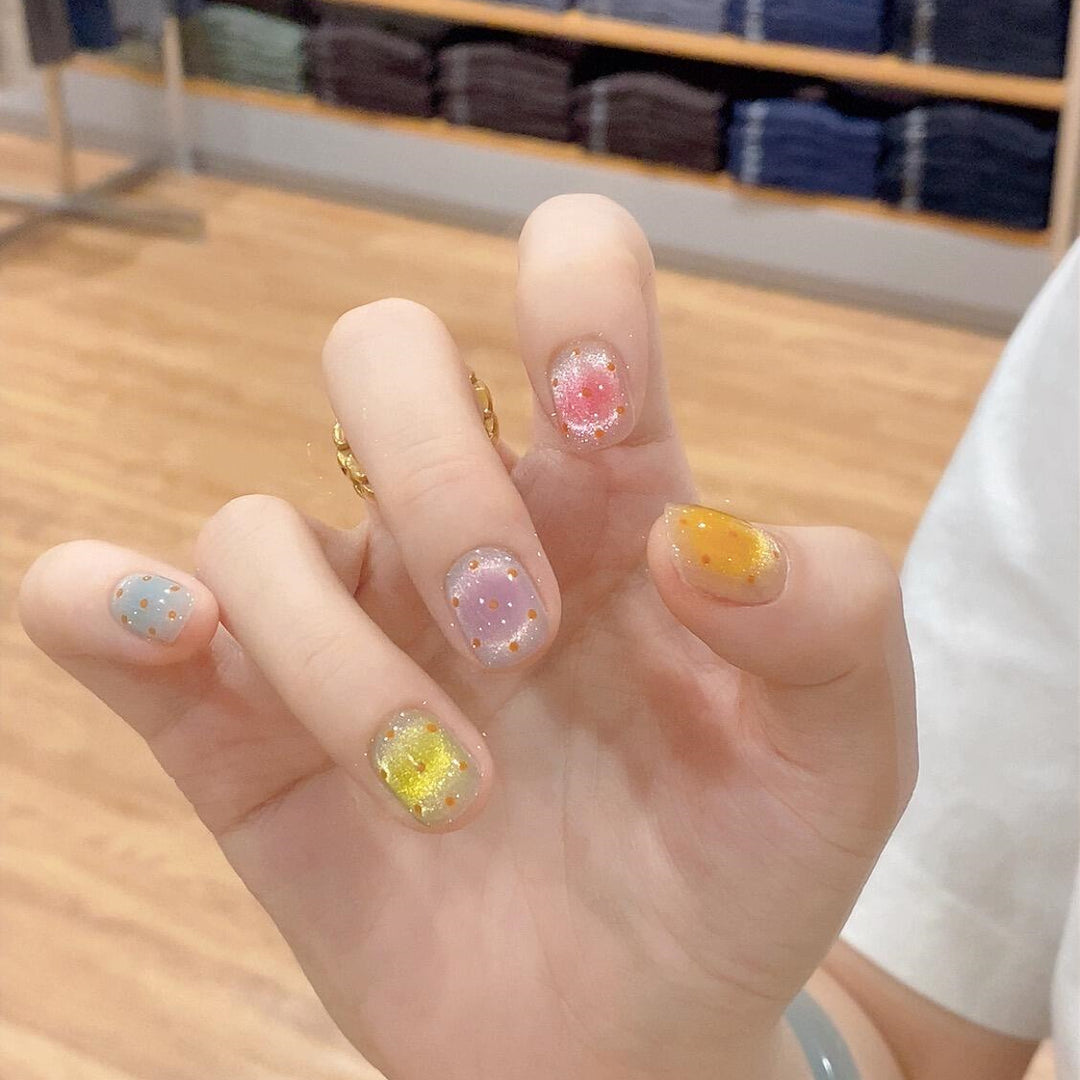 Glittering artificial nail tips in cheerful design Bowlift