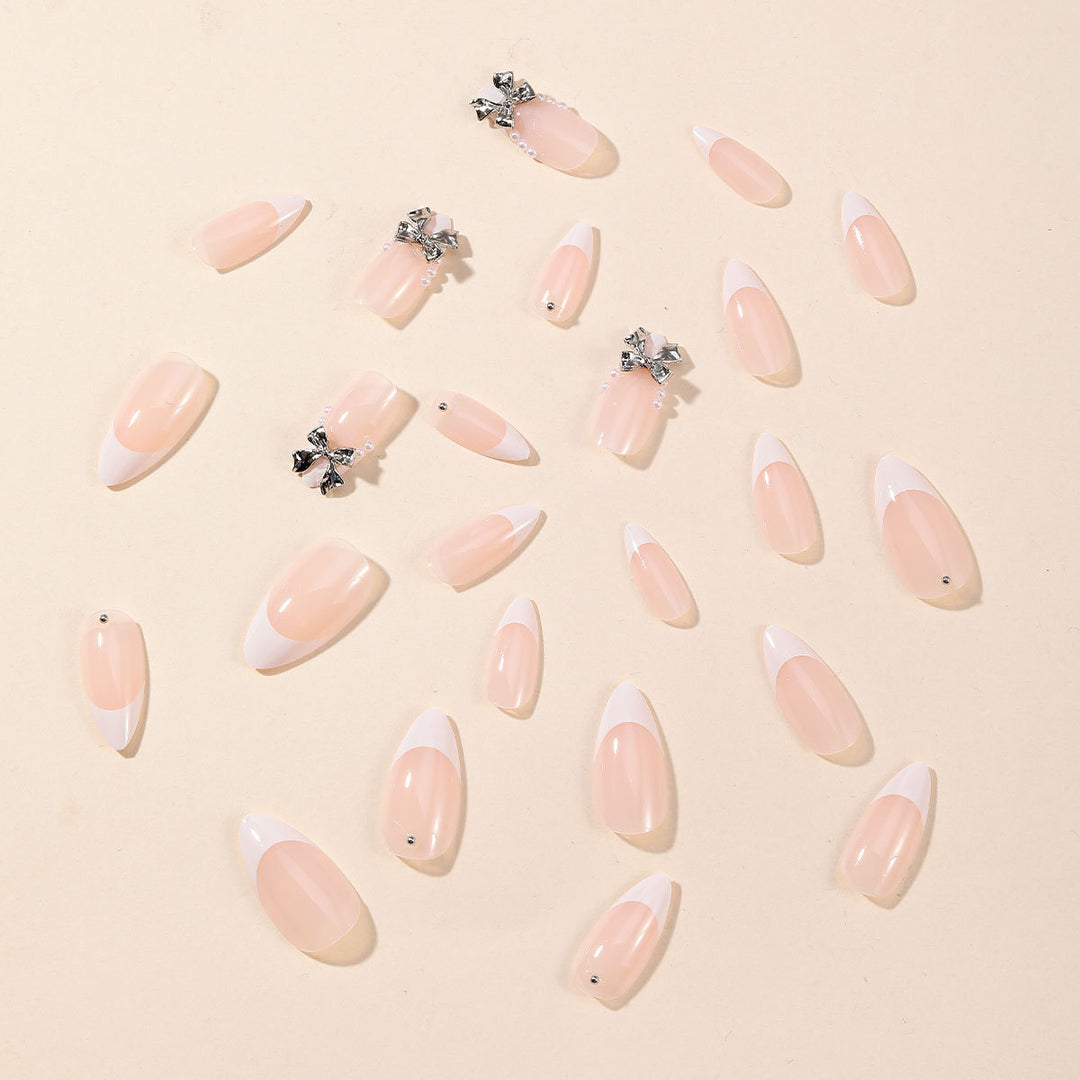 Elegant Stiletto Nail Art with Rhinestone Accents Bowlift