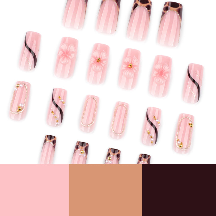 Artificial nail art with flower and glitter effects Bowlift