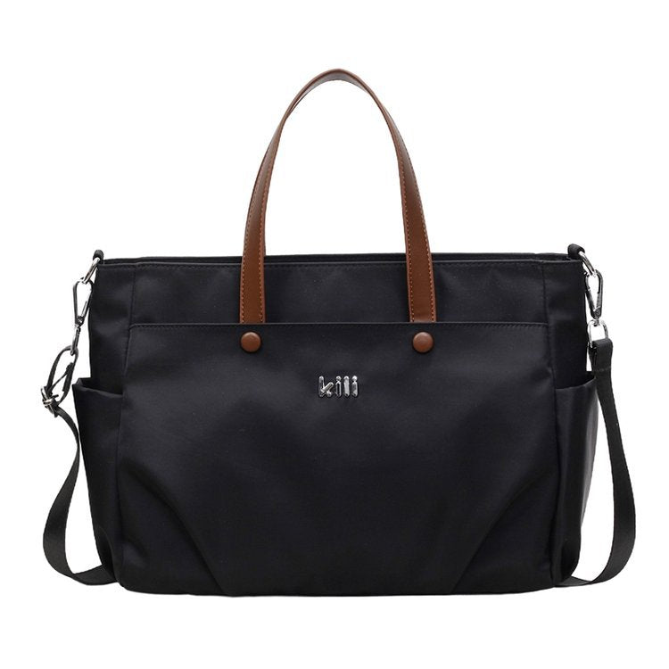Shopping bag with comfortable carrying system and practical outer pockets Bowlift