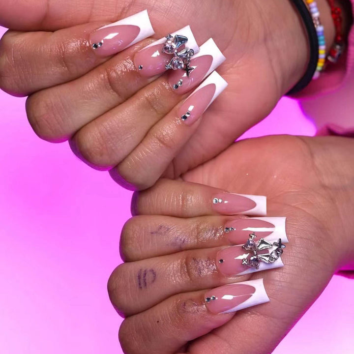 Artificial nail set with luxurious French tips and elegant embellishments Bowlift