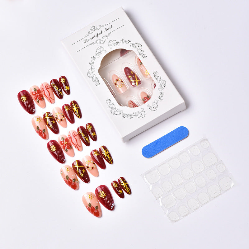 Artificial nail set in festive winter design with glamorous accents Bowlift