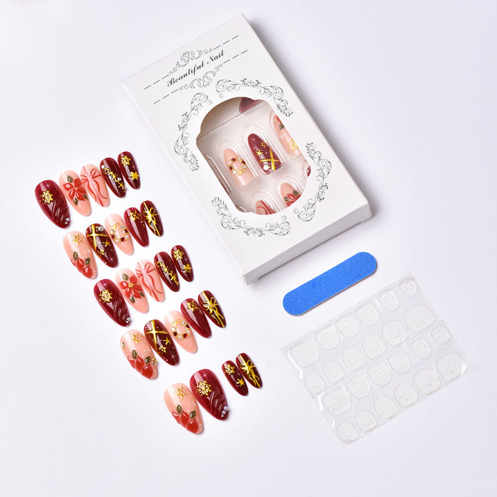 Artificial nail set in festive winter design with glamorous accents Bowlift