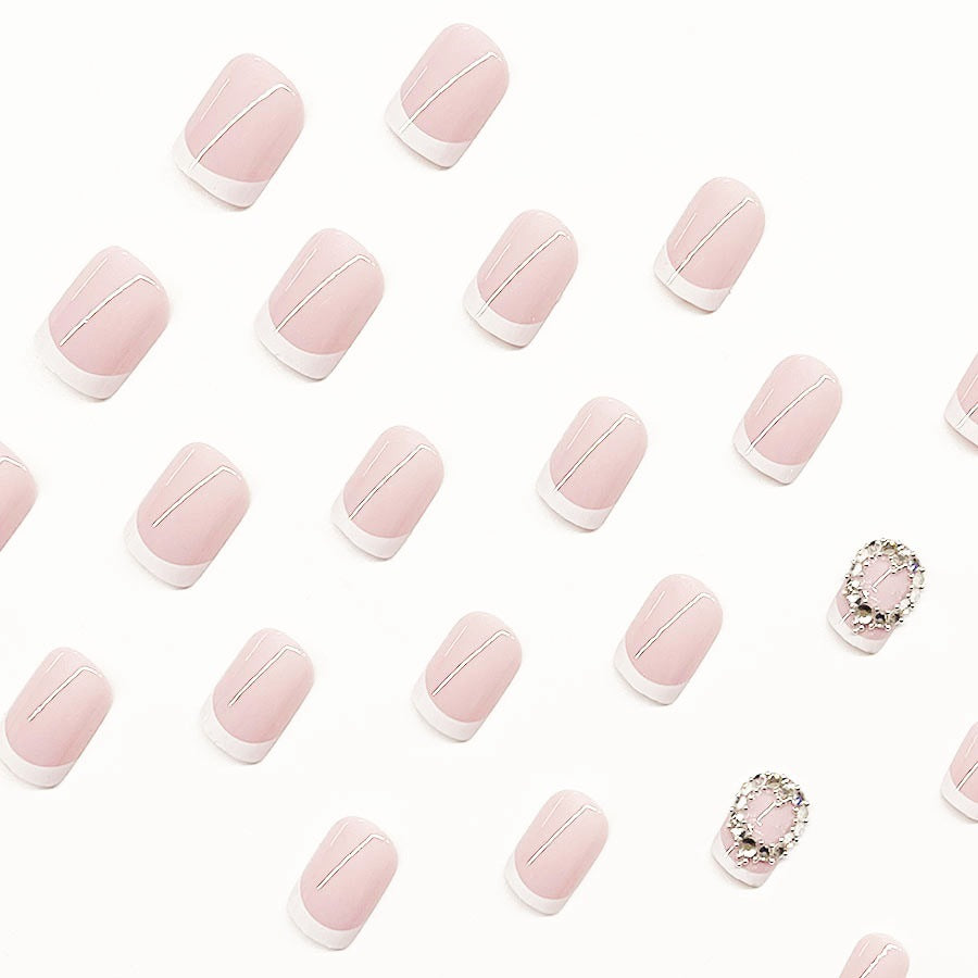 Artificial nail set with elegant French design and rhinestone embellishments Bowlift