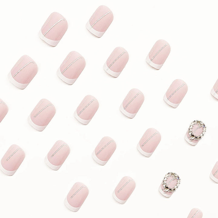 Artificial nail set with elegant French design and rhinestone embellishments Bowlift