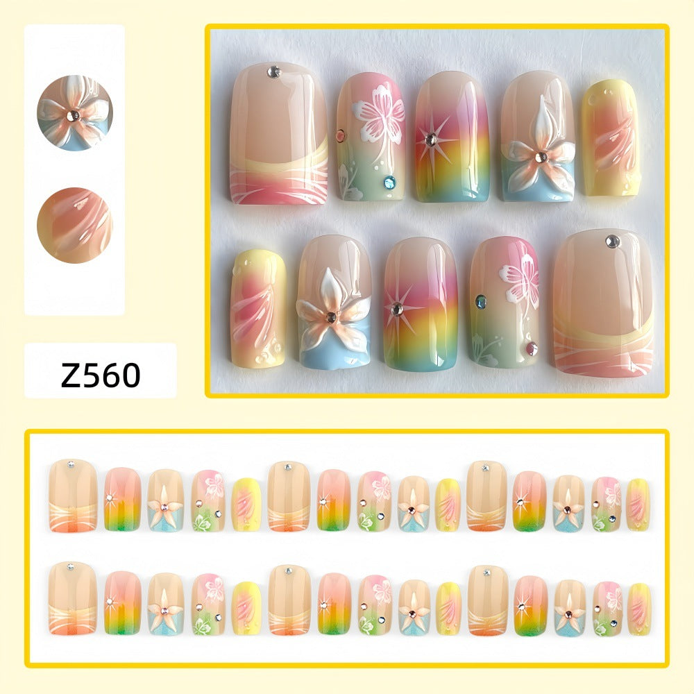 Acrylic nails with floral accents and gradient Bowlift