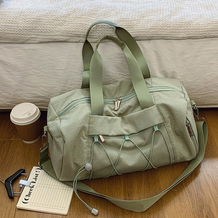 Sporty shoulder bag with adjustable carrying handles and breathable mesh material Bowlift