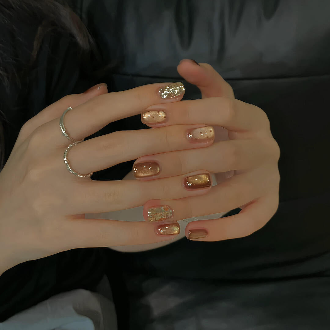 Elegant artificial nails with shimmering effects and sparkling accents Bowlift