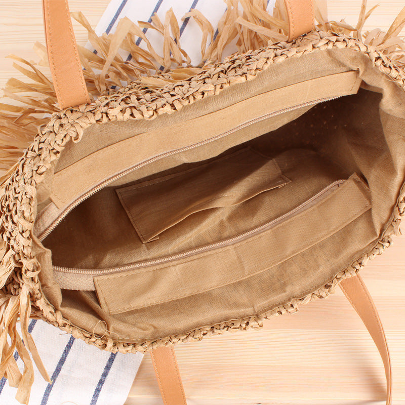 Bast crossbody bag with fringed design Bowlift