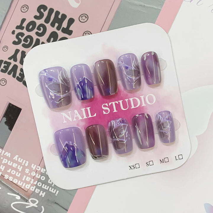 Artful acrylic nails with marbled design Bowlift