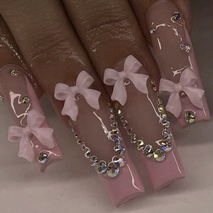 Nail art set with delicate arch decorations and rhinestone details Bowlift