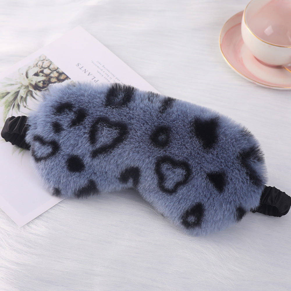 Women's cuddly faux fur sleep mask with heart-embossed surface and gathered comfort band Bowlift