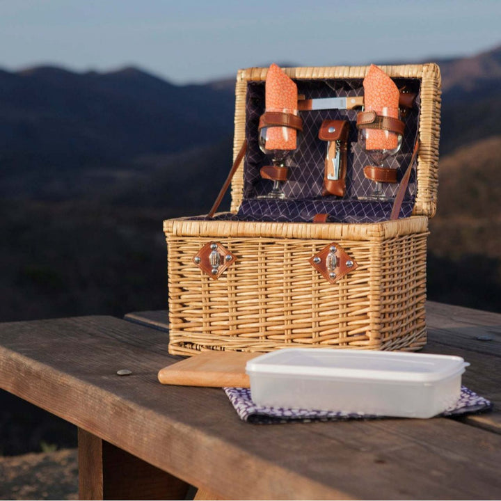 Ladies picnic basket with stylish glasses and wooden boards Bowlift