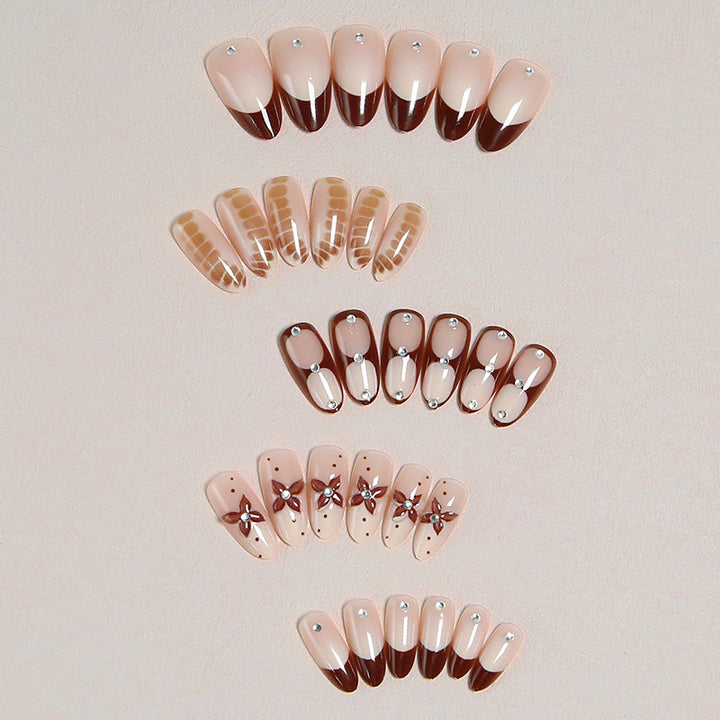 Artificial nails with elegant motif designs Bowlift