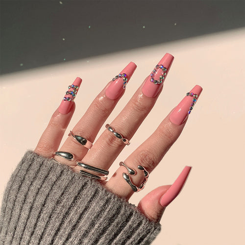 Artificial nail extensions with elegant rhinestone embellishments Bowlift