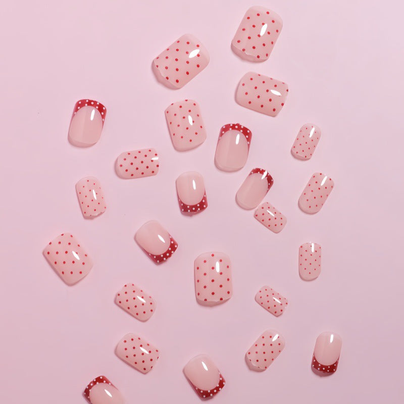 Stylish Press-On Nail Design with Polka Dot and French Tip Accents Bowlift