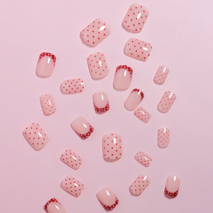Stylish Press-On Nail Design with Polka Dot and French Tip Accents Bowlift