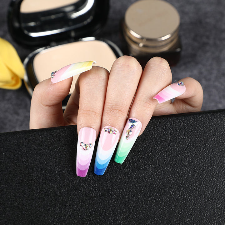 Artificial nails in luxurious ombre design with rhinestone accents Bowlift
