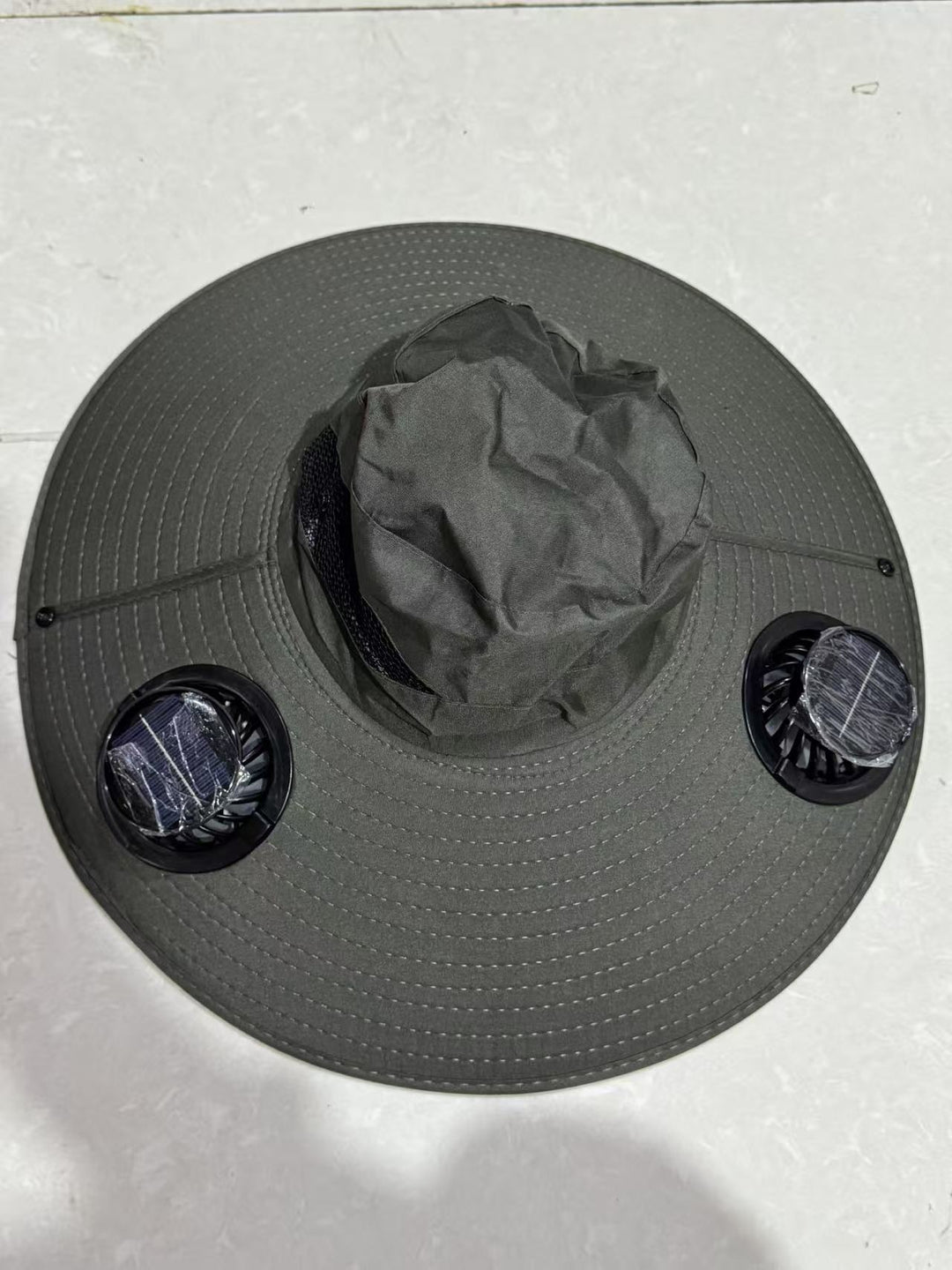 Ventilated sun hat with integrated battery fans, breathable mesh inserts, and adjustable chin strap Bowlift