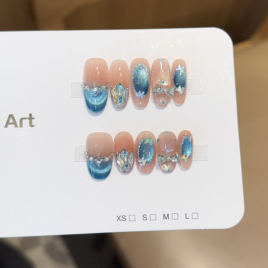 Artificial nail tips with glitter and watercolor effect Bowlift