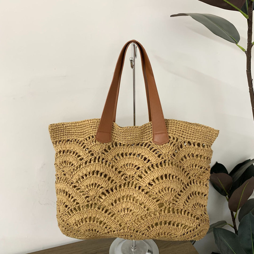 Handbag made of high-quality woven natural material with elegant leather handles Bowlift
