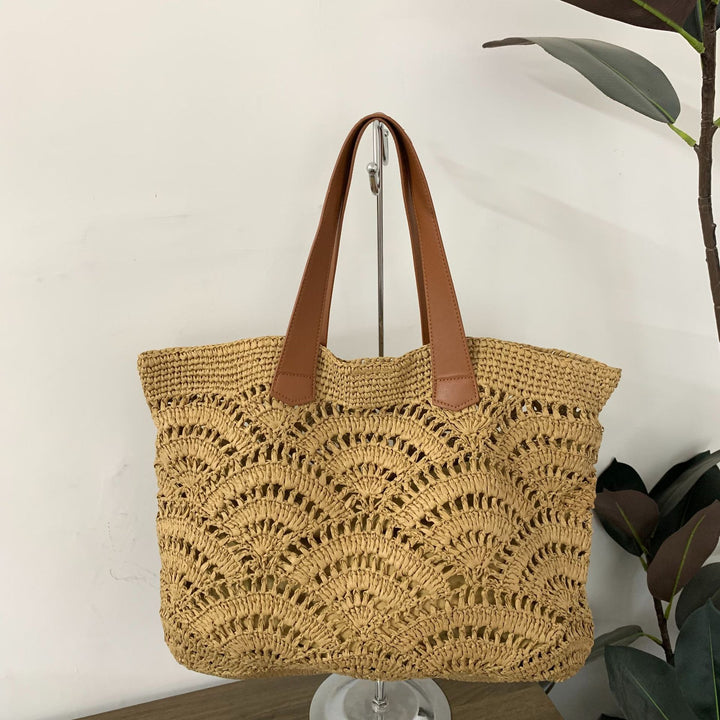 Handbag made of high-quality woven natural material with elegant leather handles Bowlift