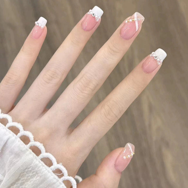 Elegant nail design with pearl embellishment Bowlift