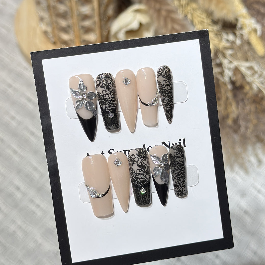 Artistic Stiletto Press-On Nail Set with Floral and Geometric Accents Bowlift