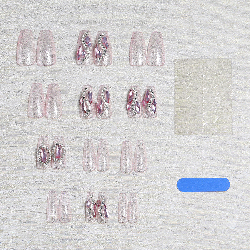 Glamorous artificial nails with sparkling rhinestone decorations Bowlift