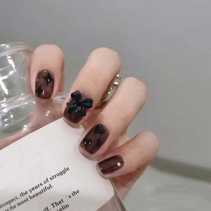 Artificial nails with elegant ribbon and heart designs Bowlift