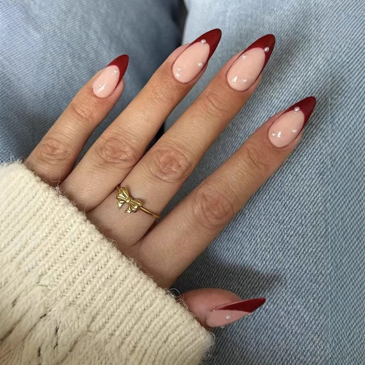 Acrylic nail set with elegant spike design and shimmering accents Bowlift